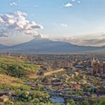 Yerevan city view with Mount Ararat in the distance during a clear sunset