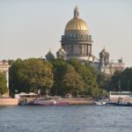 A panoramic view of the Neva River with the Winter Palace and Saint Isaac’s Cathedral in the background