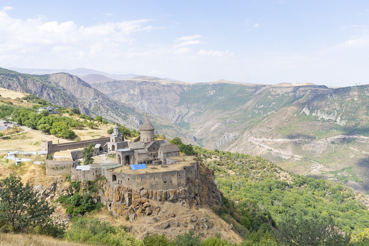 Tatev Monastery perched on a cliff with the surrounding gorge