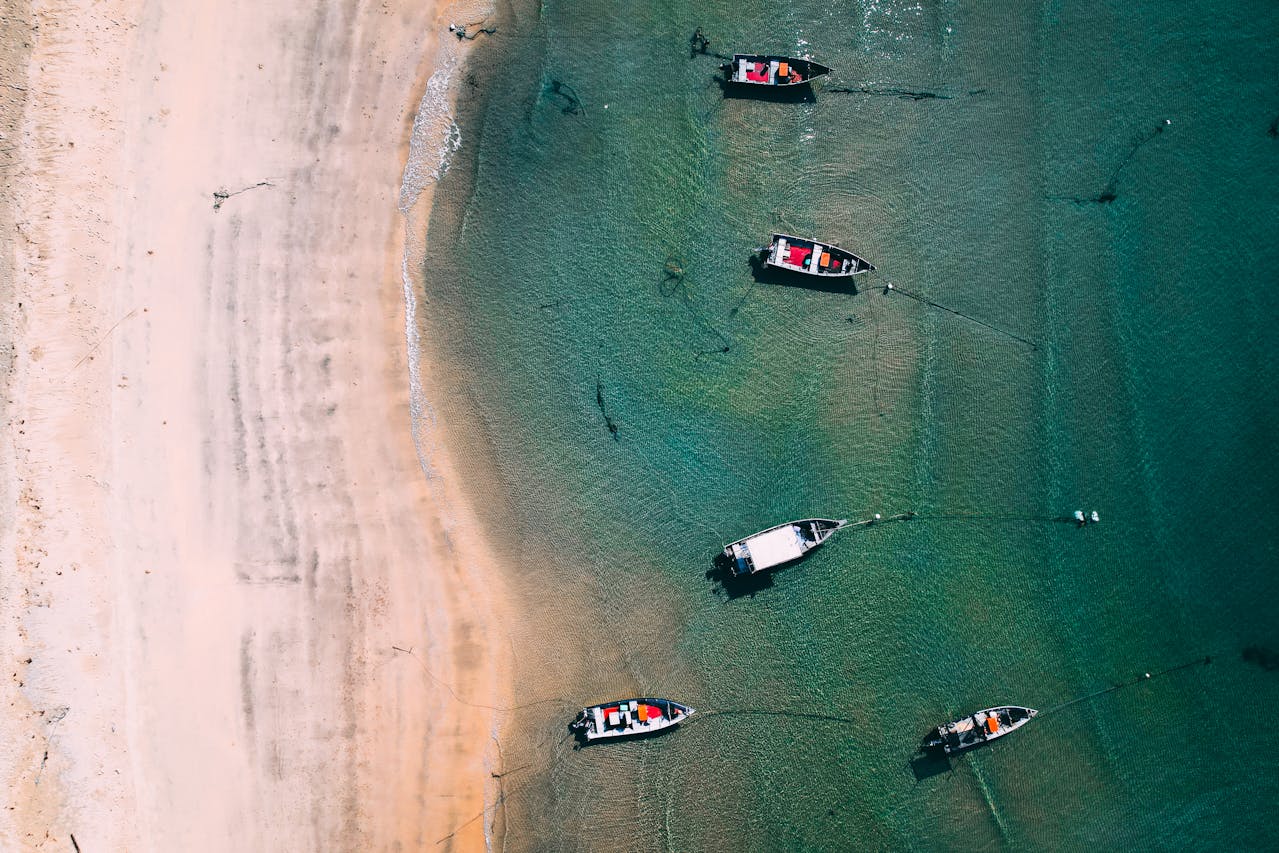 turquoise beachfront with fishermen's boats 